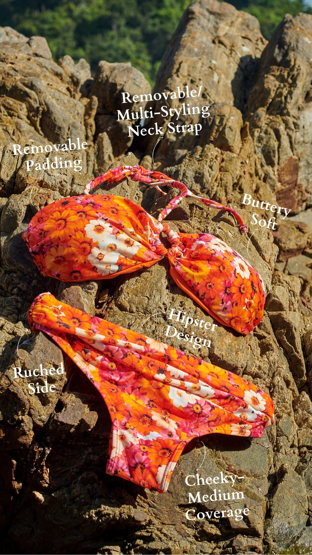 Orange floral bikini set on rocks paired with low rise bikini bottom