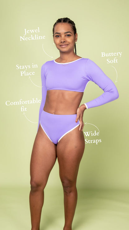 Woman wearing Trend Ripple purple long-sleeve swimsuit Australian 90s inspired timeless swimwear