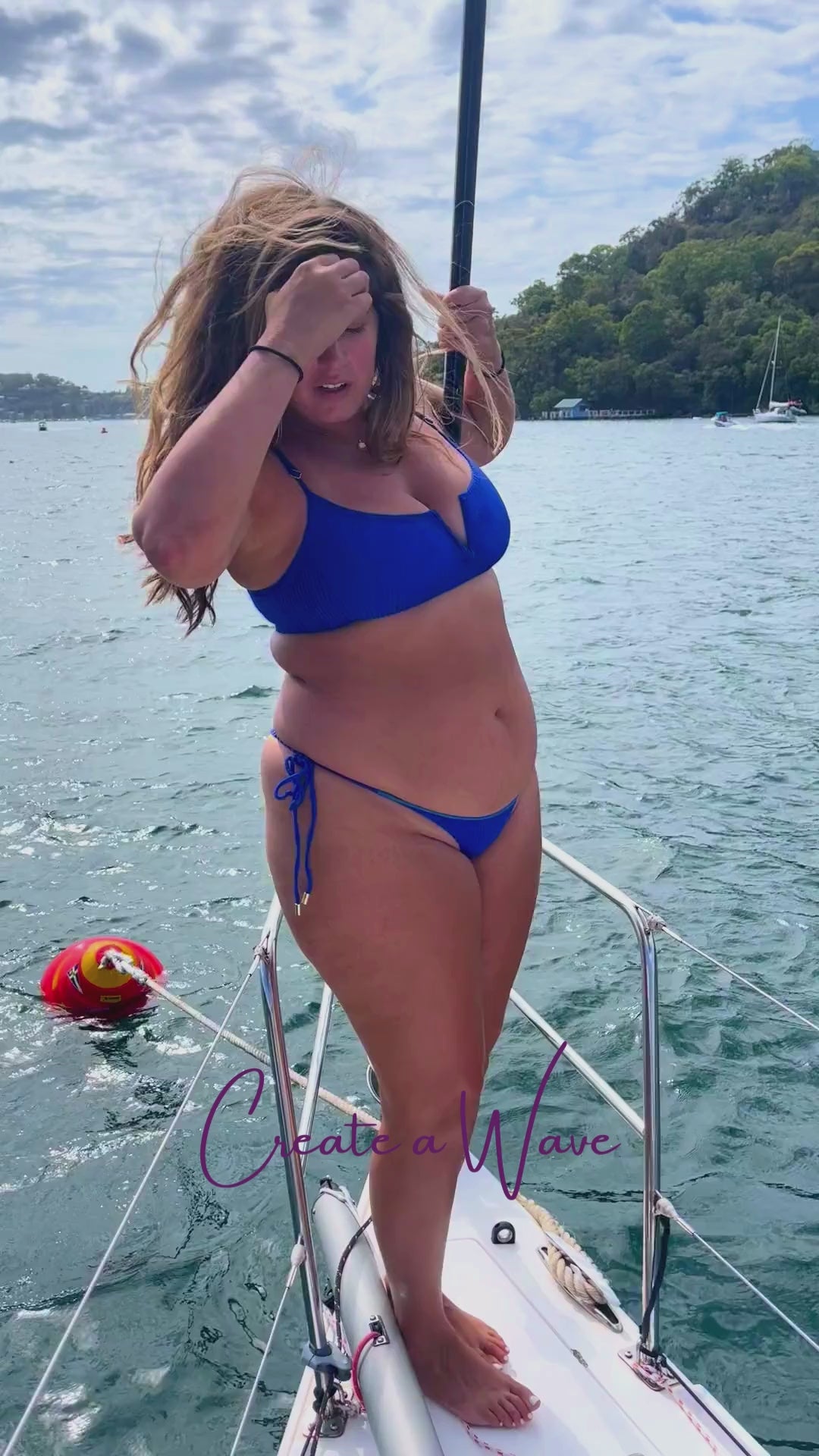 Trend Ripple_Kayles Renee Swimwear_Blue Bikini set worn by woman on a boat